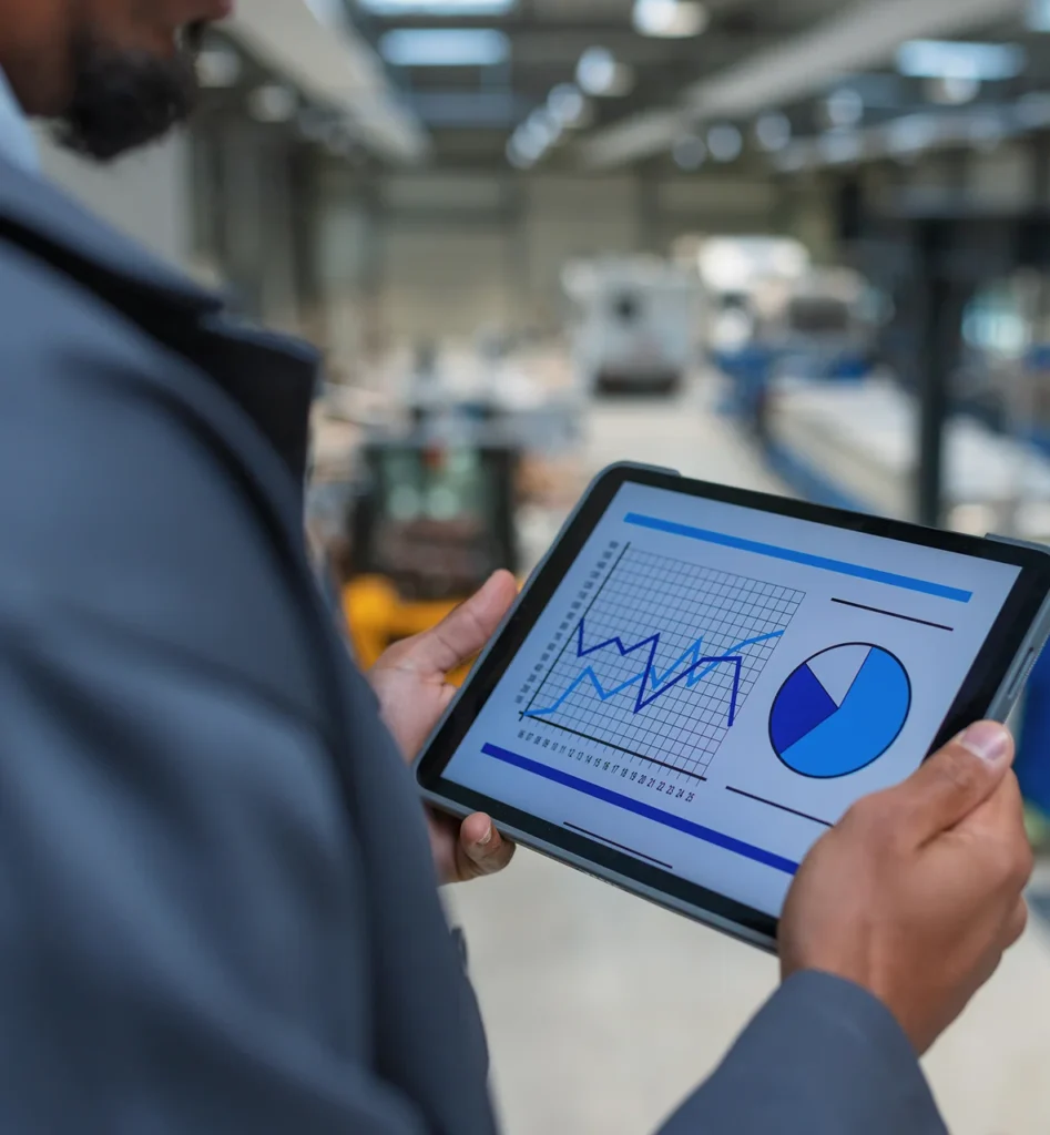 man with white helmet manager monitoring productivity factory writing